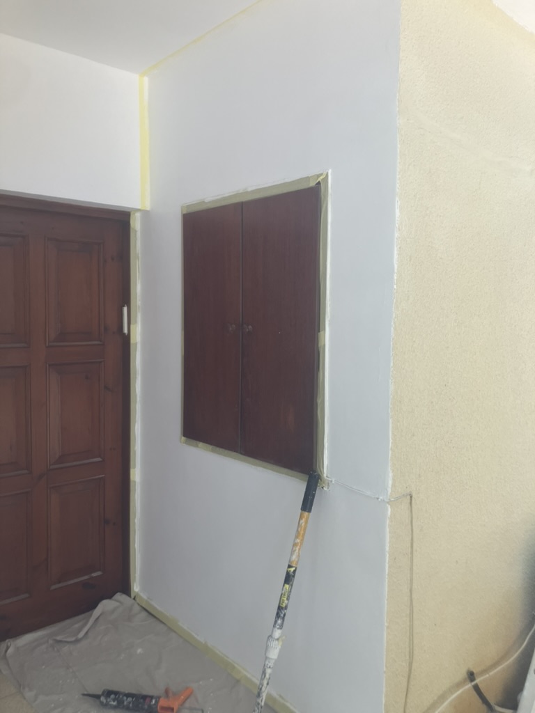 Doorway and trim masked for a careful paint job