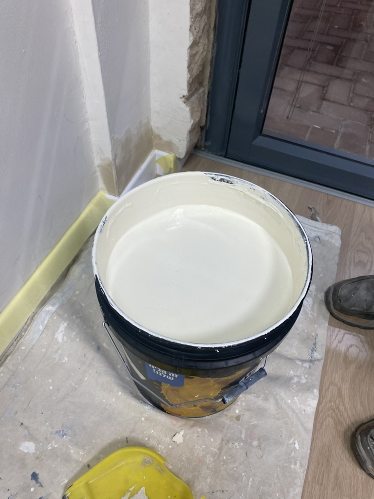 Paint and protective materials ready at a job site